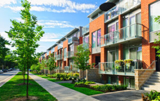 Modern town houses of brick and glass on urban street